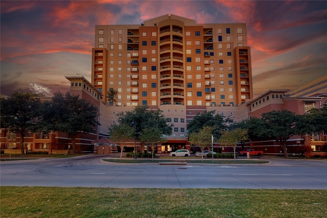 view of outdoor building at dusk