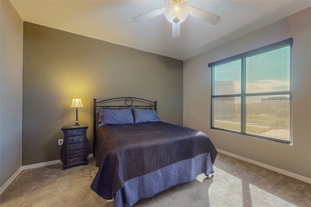 bedroom with light carpet and ceiling fan