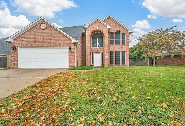 view of property with a garage and a front yard