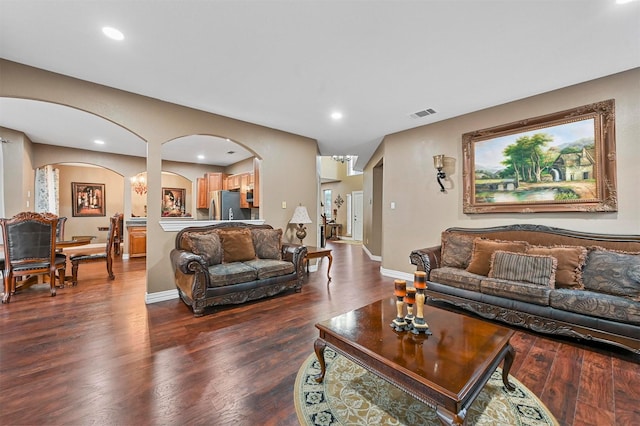 living room with dark hardwood / wood-style floors