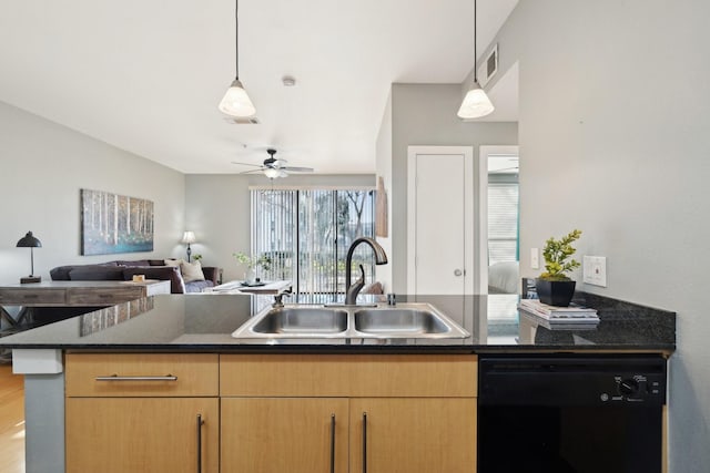 kitchen featuring dishwasher, sink, hanging light fixtures, and dark stone countertops