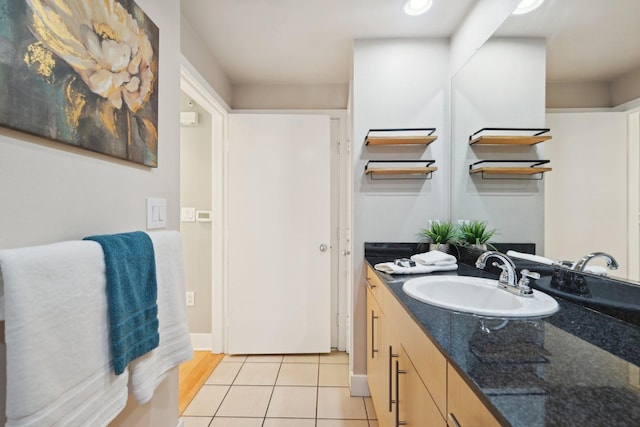 bathroom with tile patterned flooring and vanity