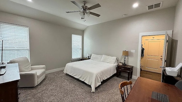 carpeted bedroom featuring ceiling fan and lofted ceiling