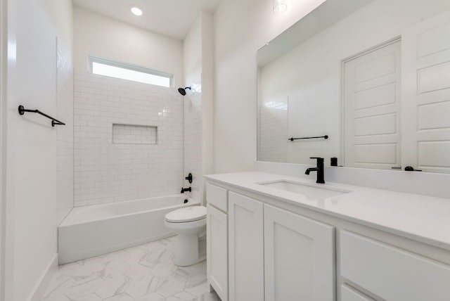 full bathroom featuring vanity, toilet, and tiled shower / bath combo