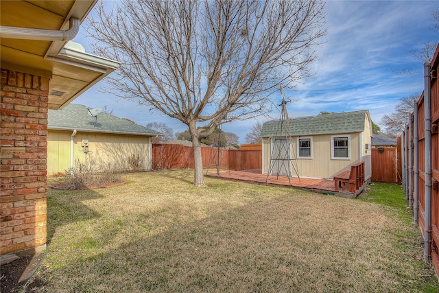 view of yard with an outdoor structure and a deck