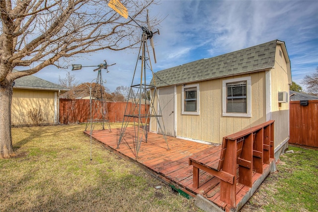 exterior space featuring an outbuilding and a wooden deck