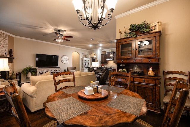 dining area with ceiling fan with notable chandelier, ornamental molding, and hardwood / wood-style flooring