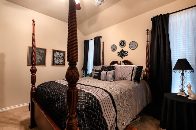 carpeted bedroom with vaulted ceiling and ceiling fan