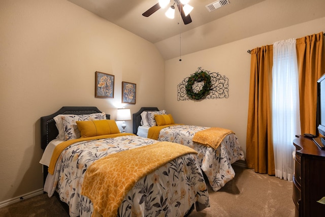 carpeted bedroom featuring ceiling fan and vaulted ceiling