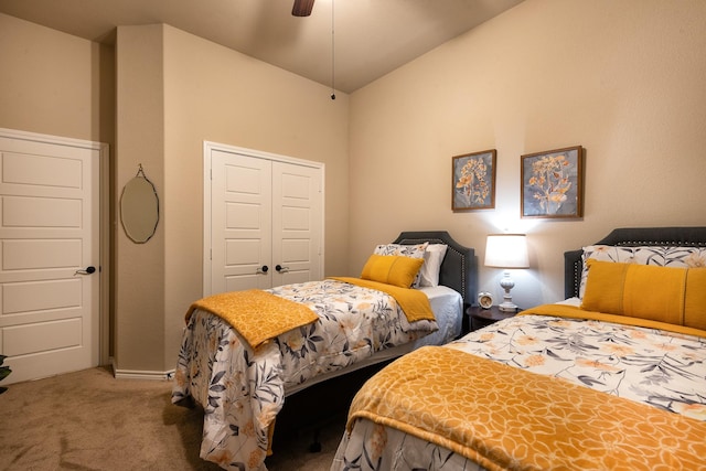 bedroom featuring carpet, ceiling fan, and a closet