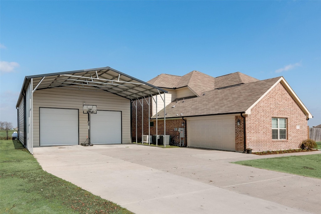 view of front facade featuring a carport and a garage