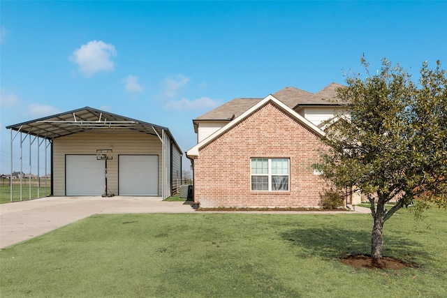 view of front of home with a carport, a garage, and a front yard