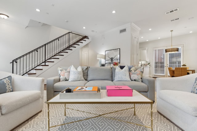 living room featuring crown molding