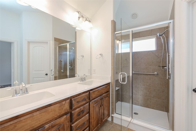 bathroom with vanity, an enclosed shower, and tile patterned floors