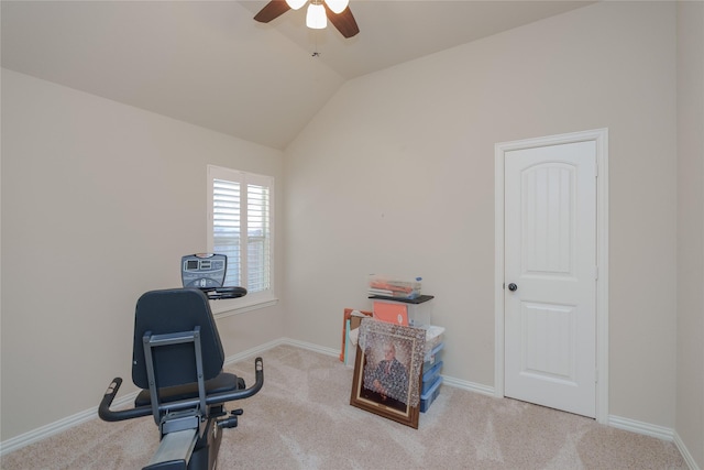 workout room with ceiling fan, lofted ceiling, and light carpet