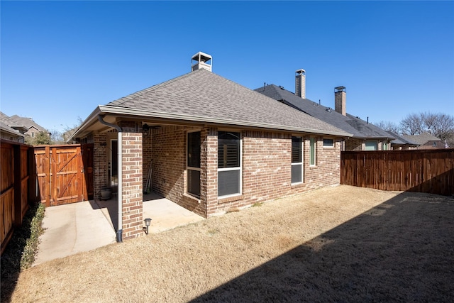 back of property with a patio