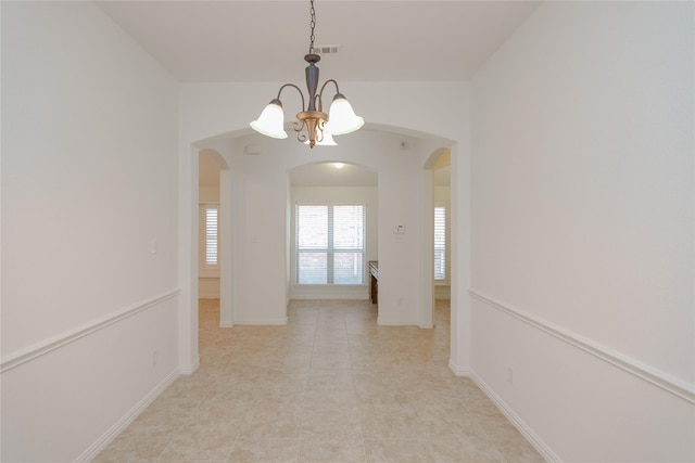 interior space with a chandelier