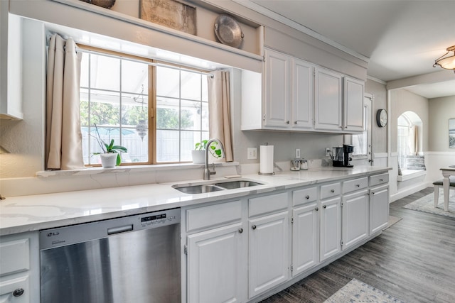 7502 Atlantic Dr, Rowlett, TX 75088 - kitchen with stainless steel dishwasher, a sink, white cabinetry, dark wood-style floors, and light stone counters