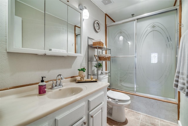 full bathroom featuring bath / shower combo with glass door, vanity, toilet, and tile patterned flooring