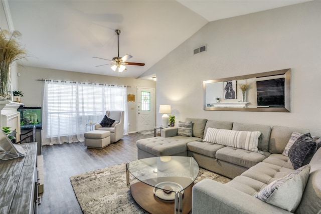 7502 Atlantic Dr, Rowlett, TX 75088 - living room featuring ceiling fan, wood finished floors, high vaulted ceiling, and baseboards