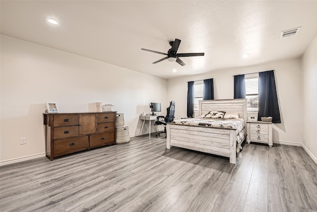 bedroom with baseboards, visible vents, a ceiling fan, light wood-type flooring, and recessed lighting