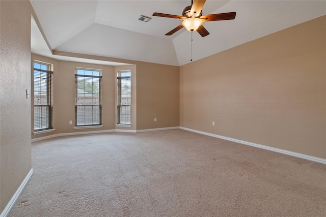 spare room with ceiling fan, light colored carpet, and lofted ceiling