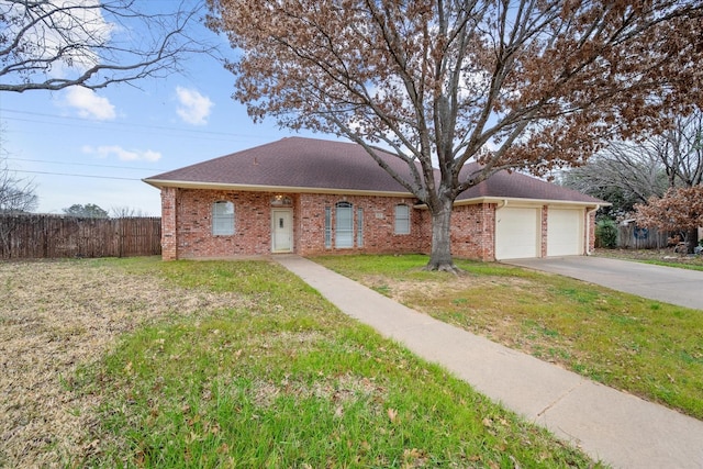 ranch-style home featuring a garage and a front yard