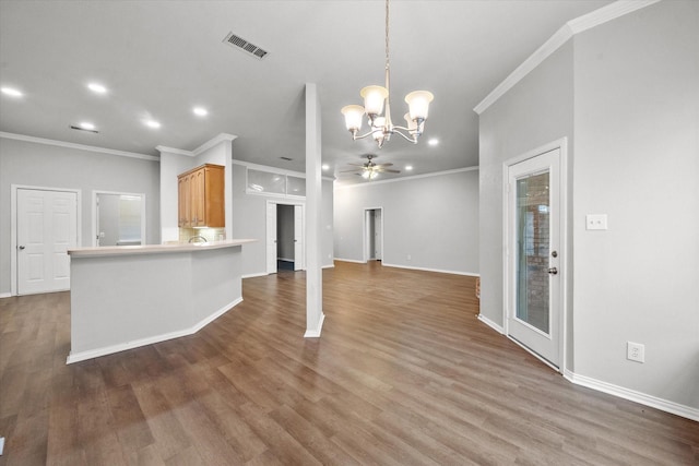 unfurnished living room featuring hardwood / wood-style flooring, crown molding, and ceiling fan with notable chandelier