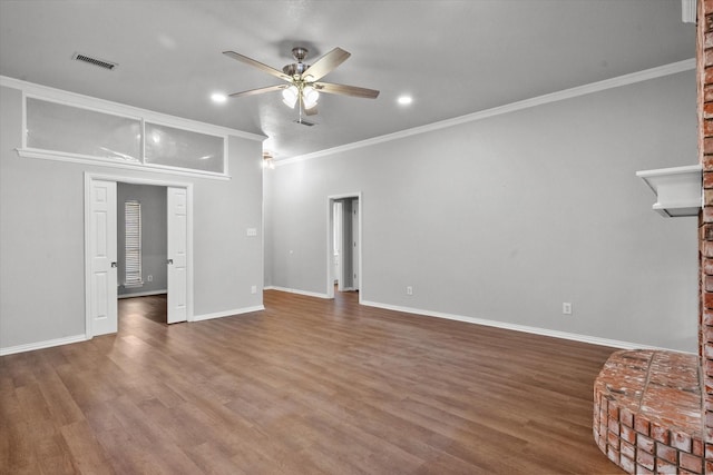 unfurnished living room with crown molding, dark wood-type flooring, and ceiling fan