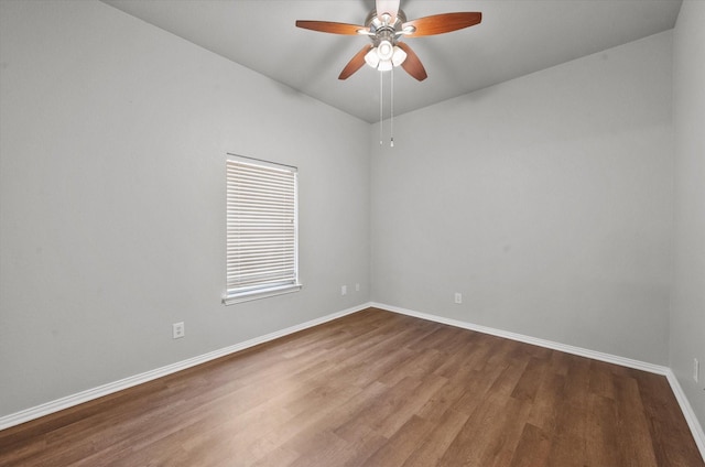 empty room with ceiling fan and wood-type flooring