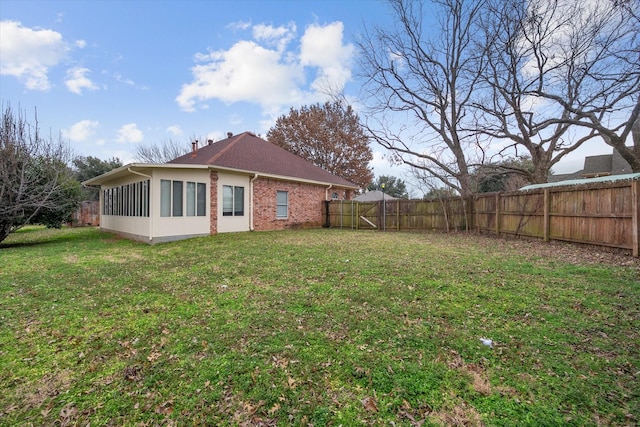 view of yard featuring a sunroom