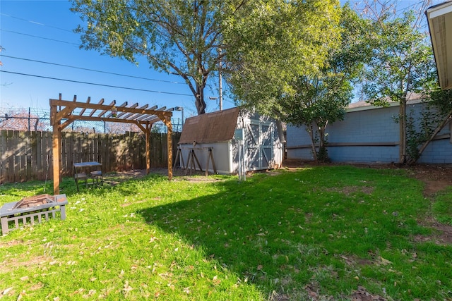 view of yard with a pergola and a shed