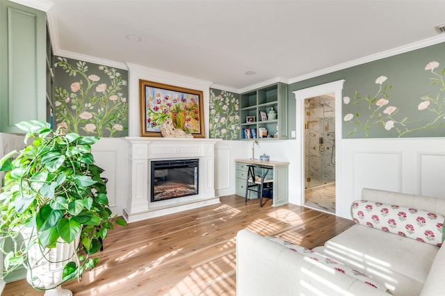 unfurnished living room featuring crown molding and light hardwood / wood-style flooring