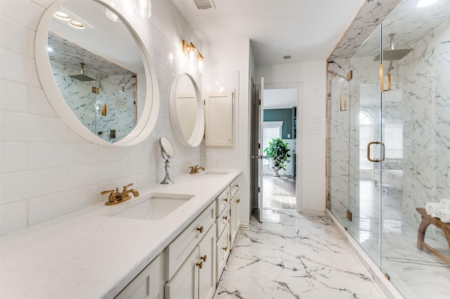 bathroom featuring vanity and an enclosed shower