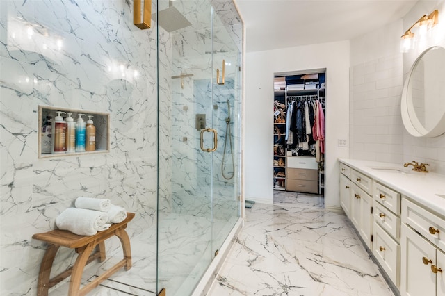 bathroom featuring vanity and an enclosed shower