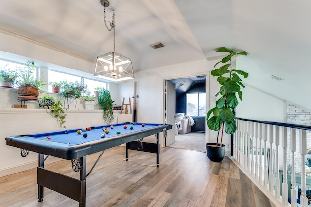 rec room with wood-type flooring and vaulted ceiling