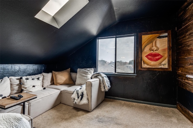 interior space with lofted ceiling with skylight, light carpet, and a textured ceiling