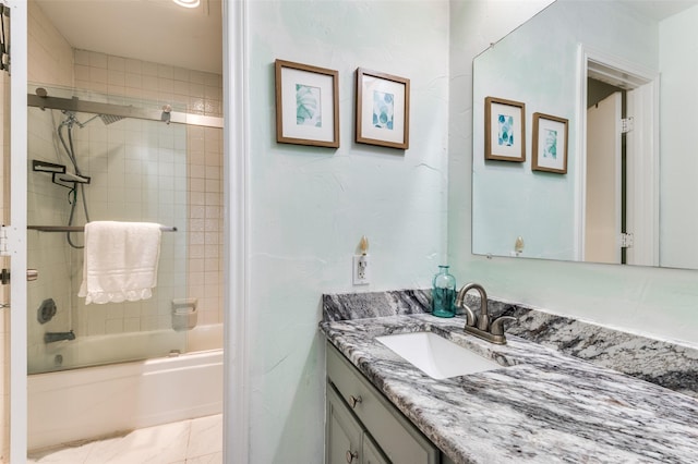 bathroom with vanity and shower / bath combination with glass door