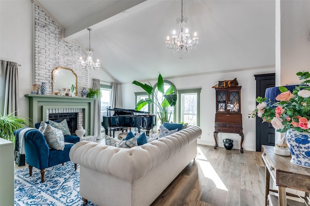 living room with dark wood-type flooring, a fireplace, a chandelier, and beamed ceiling