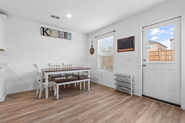 dining area with light wood-type flooring