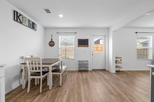 dining room with light wood-type flooring