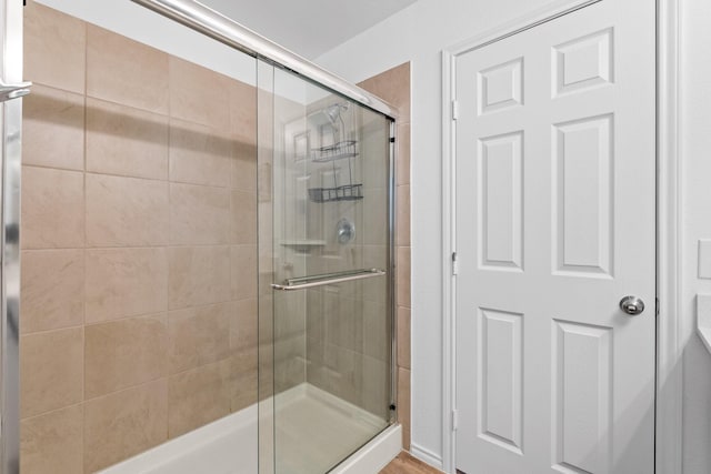 bathroom featuring an enclosed shower