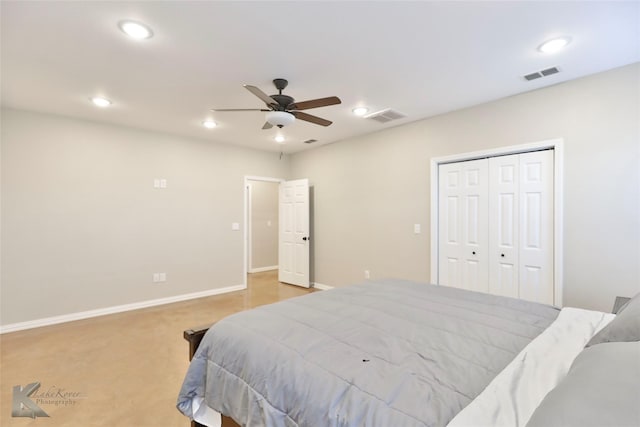 bedroom with ceiling fan, light carpet, and a closet