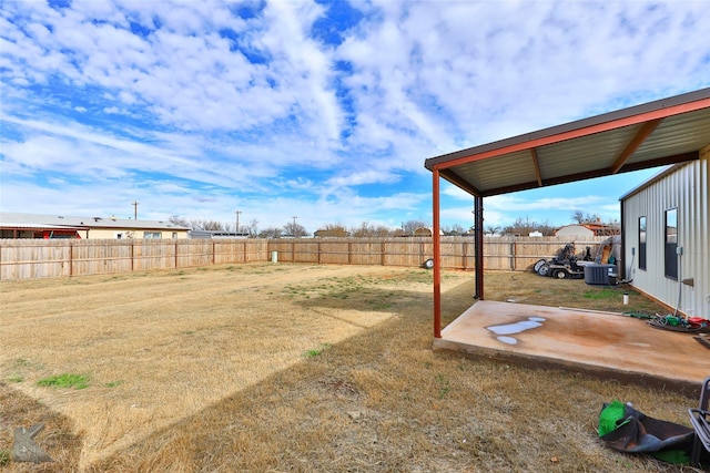 view of yard featuring a patio and central air condition unit