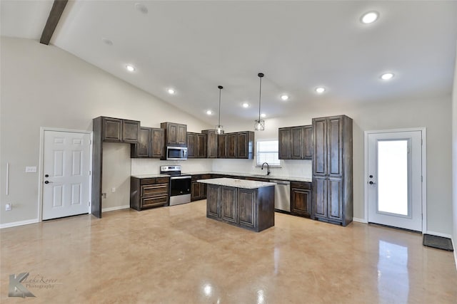 kitchen featuring a kitchen island, decorative light fixtures, sink, stainless steel appliances, and beam ceiling