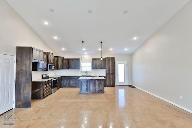 kitchen featuring stainless steel appliances, a kitchen island, hanging light fixtures, and dark brown cabinets