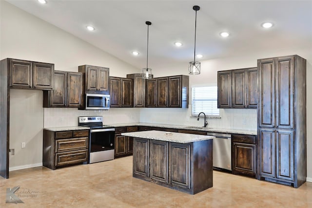 kitchen with decorative light fixtures, sink, a center island, dark brown cabinetry, and stainless steel appliances