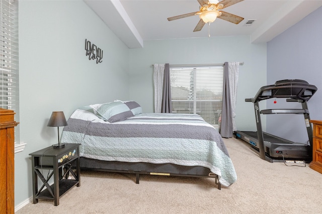 bedroom featuring light carpet and ceiling fan