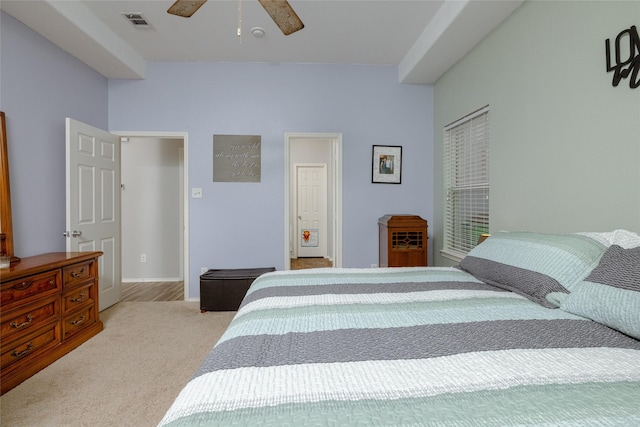 bedroom featuring ceiling fan and light carpet