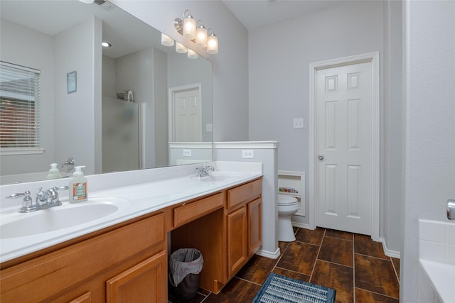 full bathroom with vanity, plus walk in shower, and toilet